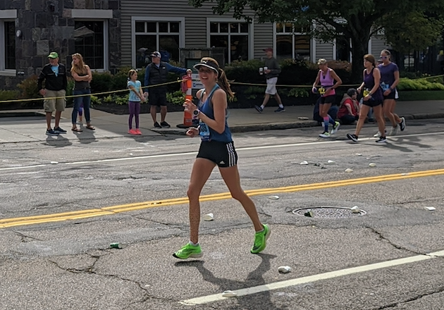 The author runs through Wellesley in the Boston Marathon. 